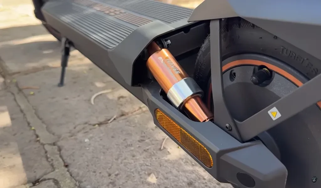 close-up on the rear suspension and electric motor of the Navee GT3-series electric scooter