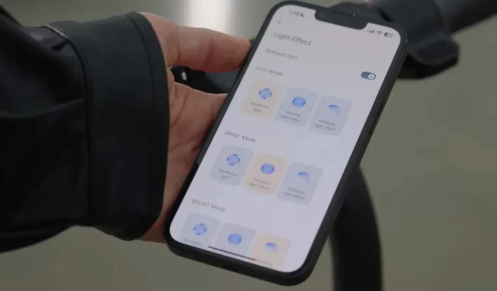 Hand with mobile phone showing how to change speed control in mobile app
