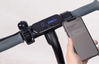 Parent showing how to adjust speed on electric scooter built for kids